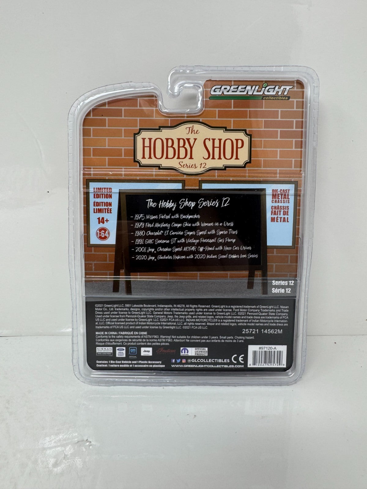 Greenlight The Hobby Shop 1975 Nissan Patrol with Backpacker 1:64 Diecast
