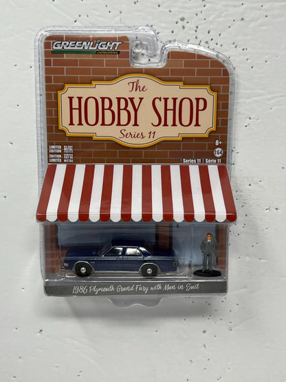 Greenlight The Hobby Shop 1986 Plymouth Grand Fury with Man in Suit 1:64 Diecast