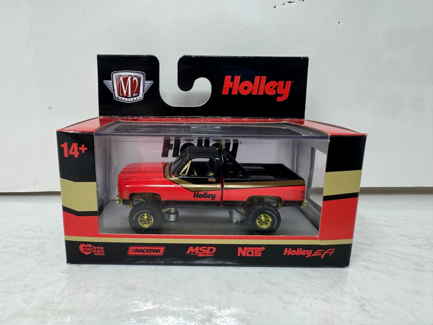 M2 Machines Holley 1976 GMC Sierra Grande 15 4x4 CHASE 1:64 Diecast