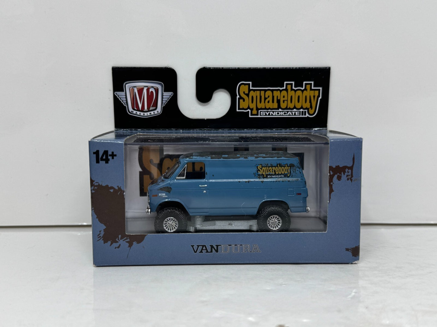 M2 Machines Squarebody Syndicate 1973 GMC Vandura 4x4 1:64 Diecast