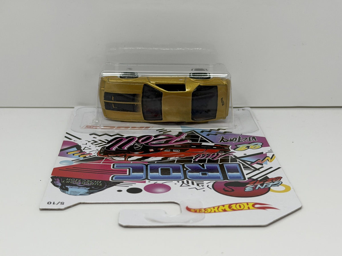 Hot Wheels 50th IROC and Roll 1985 Chevrolet Camaro IROC-Z 1:64 Diecast Gold
