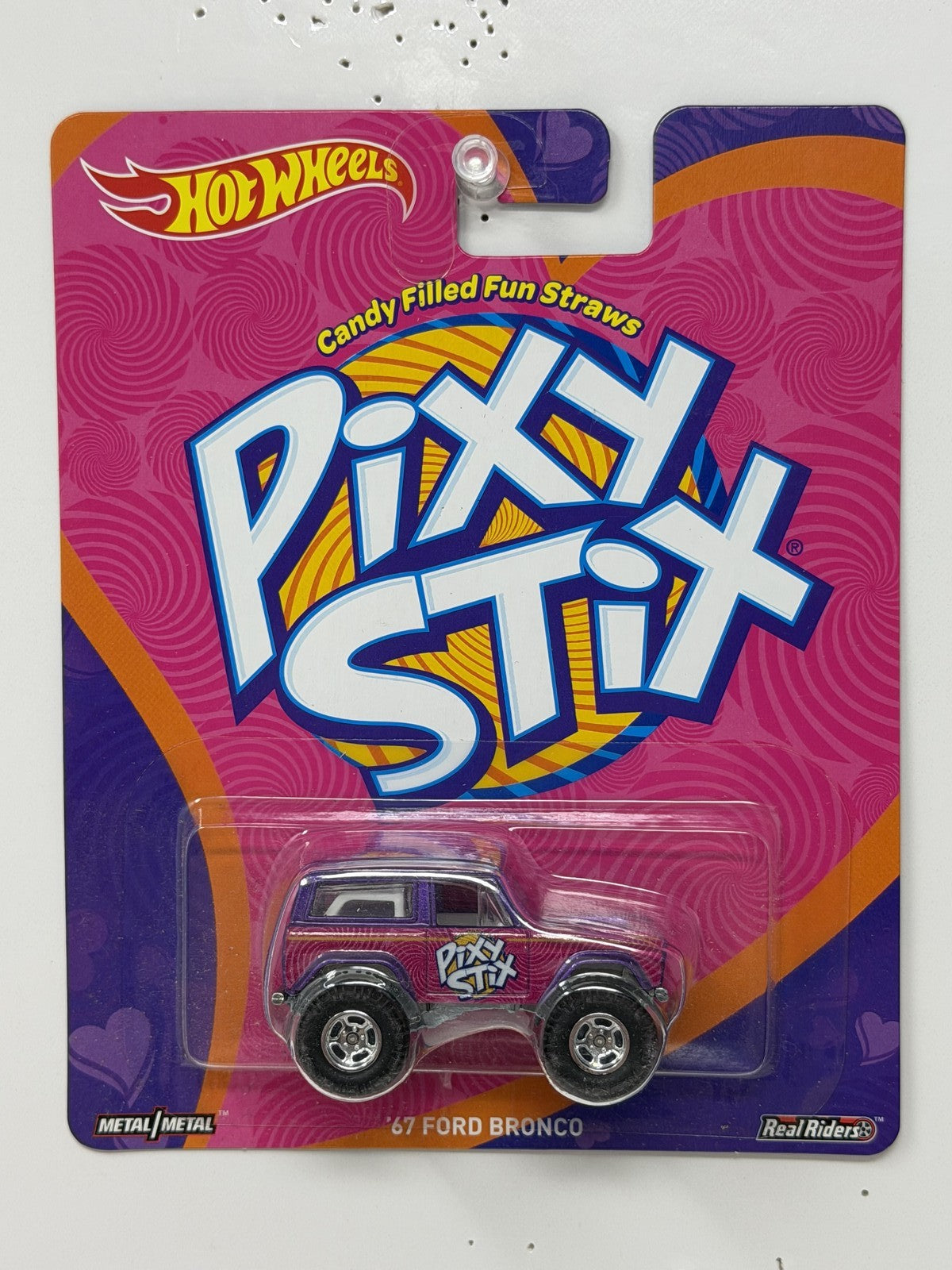 Hot Wheels Pixy Stix 1967 Ford Bronco 1:64 Diecast Real Riders