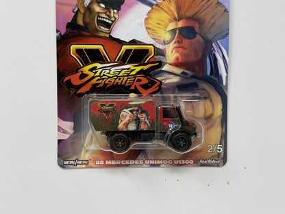Hot Wheels Street Fighter V 1988 Mercedes Unimog U1300 1:64 Diecast Real Riders