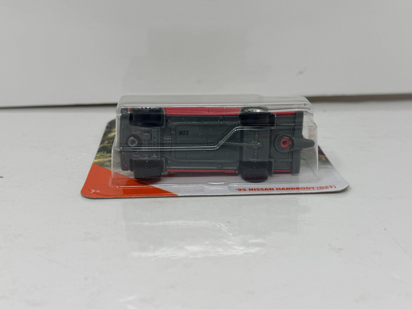 Matchbox MBX Jungle 1995 Nissan Hardbody (D21) 1:64 Diecast Short Card